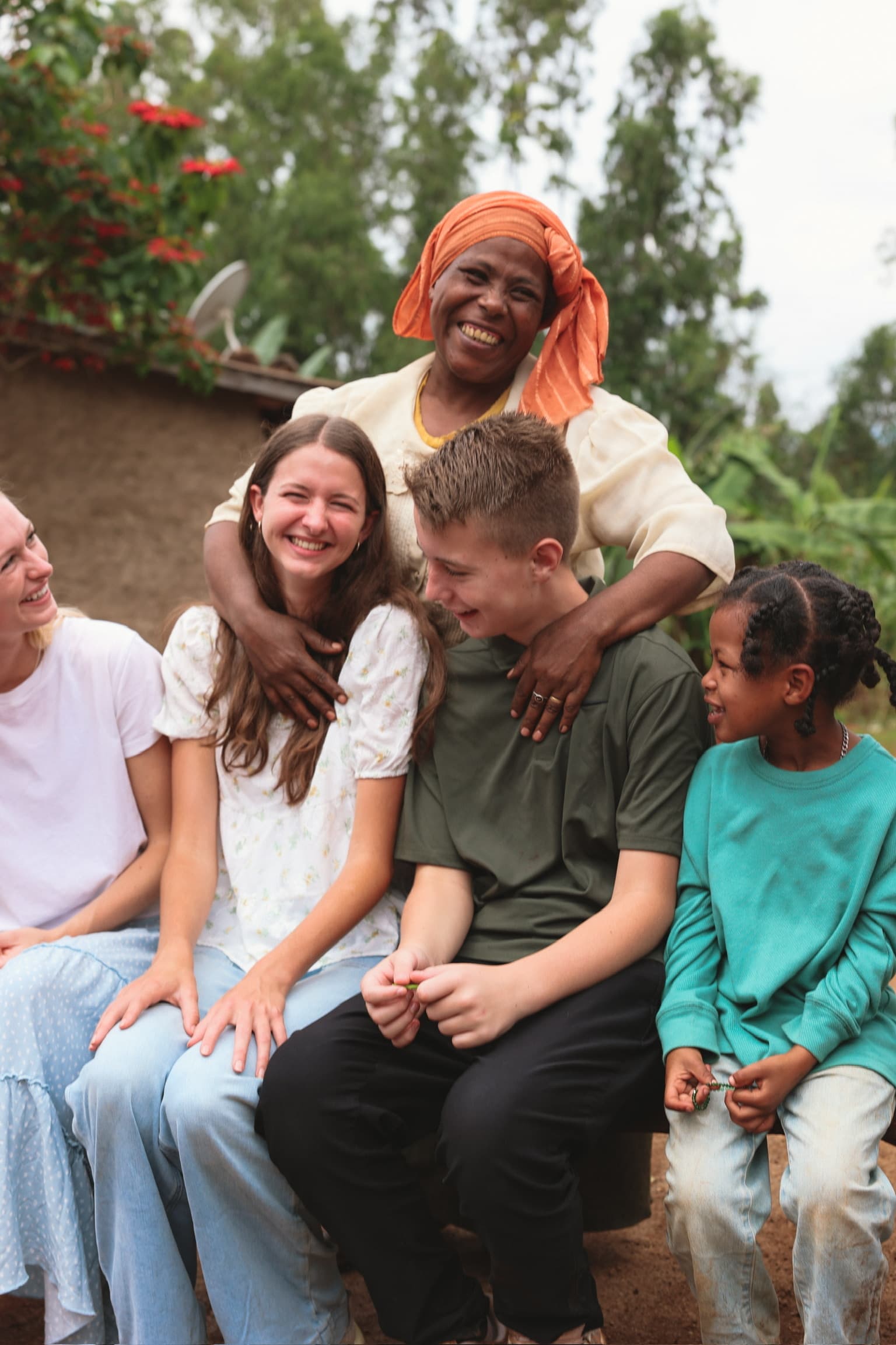A Harbour team member with a family served through our missions partnerships